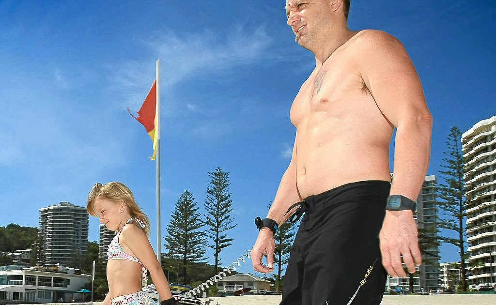 RIGHT, SAFETY FIRST: Vincent Ryan and daughter Sharli go for a swim with the Beach Buddy invention. RIGHT, SAFETY FIRST: Vincent Ryan and daughter Sharli go for a swim with the Beach Buddy invention.